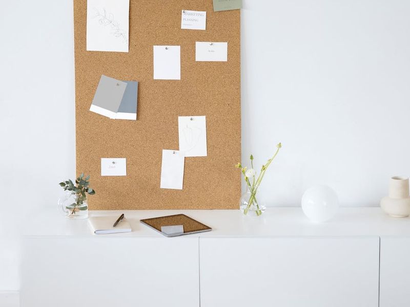 Designer presenting interior concept to clients with mood boards