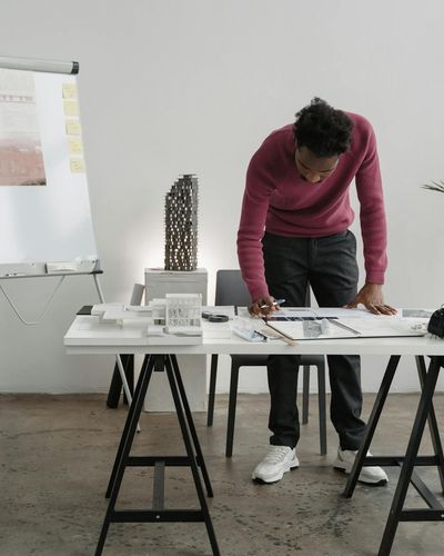 Man architect reviewing design plans