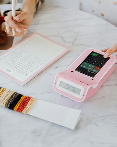 Woman decorator selecting textile samples